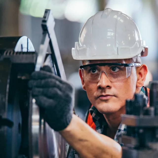 Man In Hardhat Machinery Worker